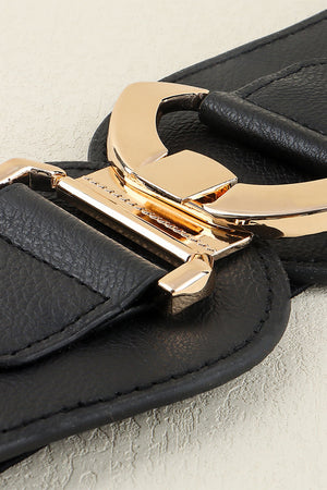 Black elasticated corset belt with a sculpted gold alloy buckle detail.