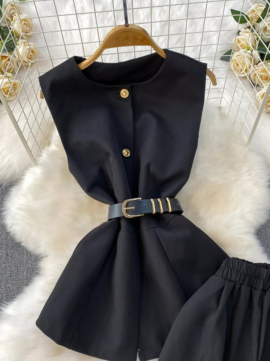 Black belted two-piece set with gold button detail and pockets