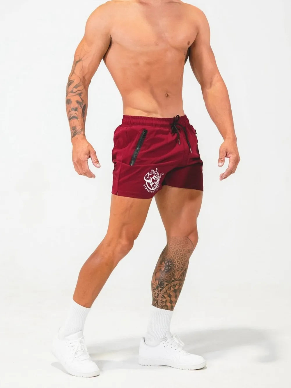 Deep Red athletic shorts with drawstring and zippered pockets, featuring a white logo.