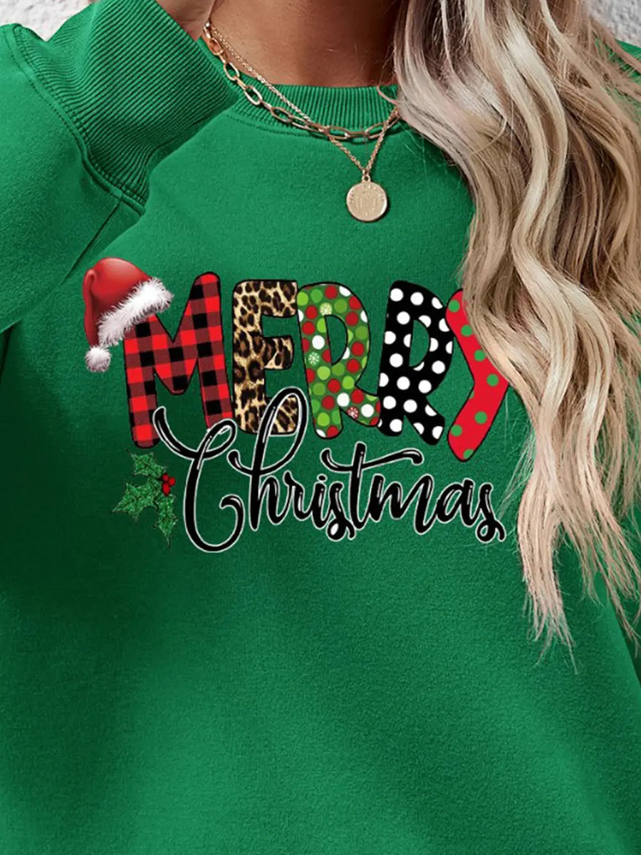 Green graphic sweatshirt with Merry Christmas text and festive patterns.
