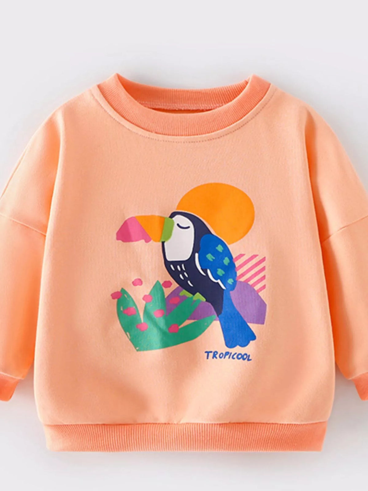 Tangerine crew neck sweatshirt for kids with a toucan graphic and "TROPICOOL" text.