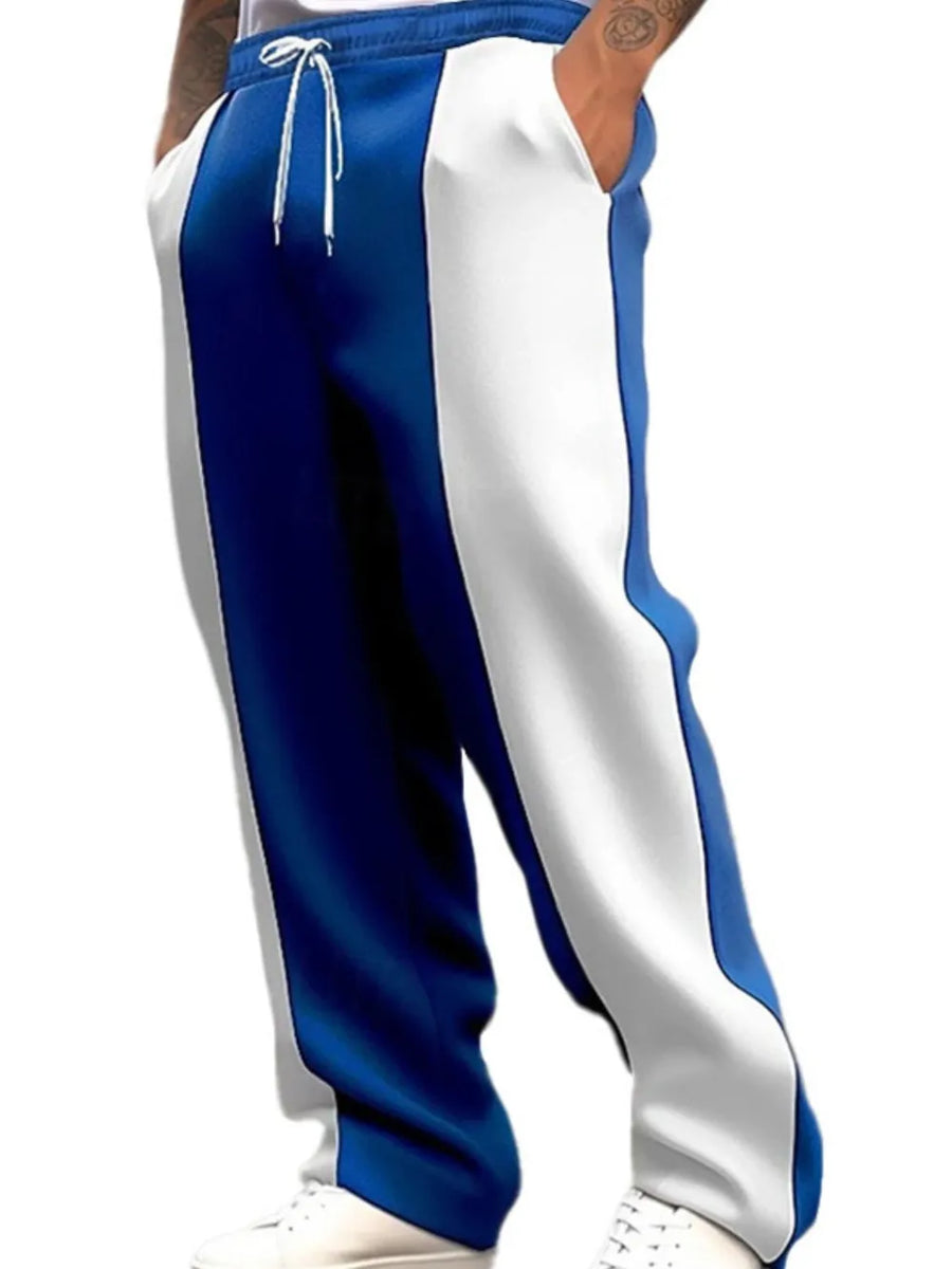 Panelled track pants in royal blue and white with drawstring waist.