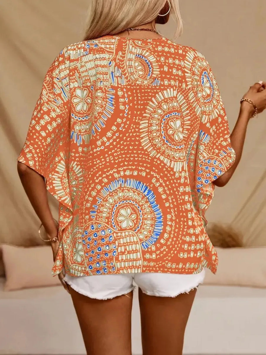 Bohemian print V-neck t-shirt in orange with a relaxed fit and short sleeves.