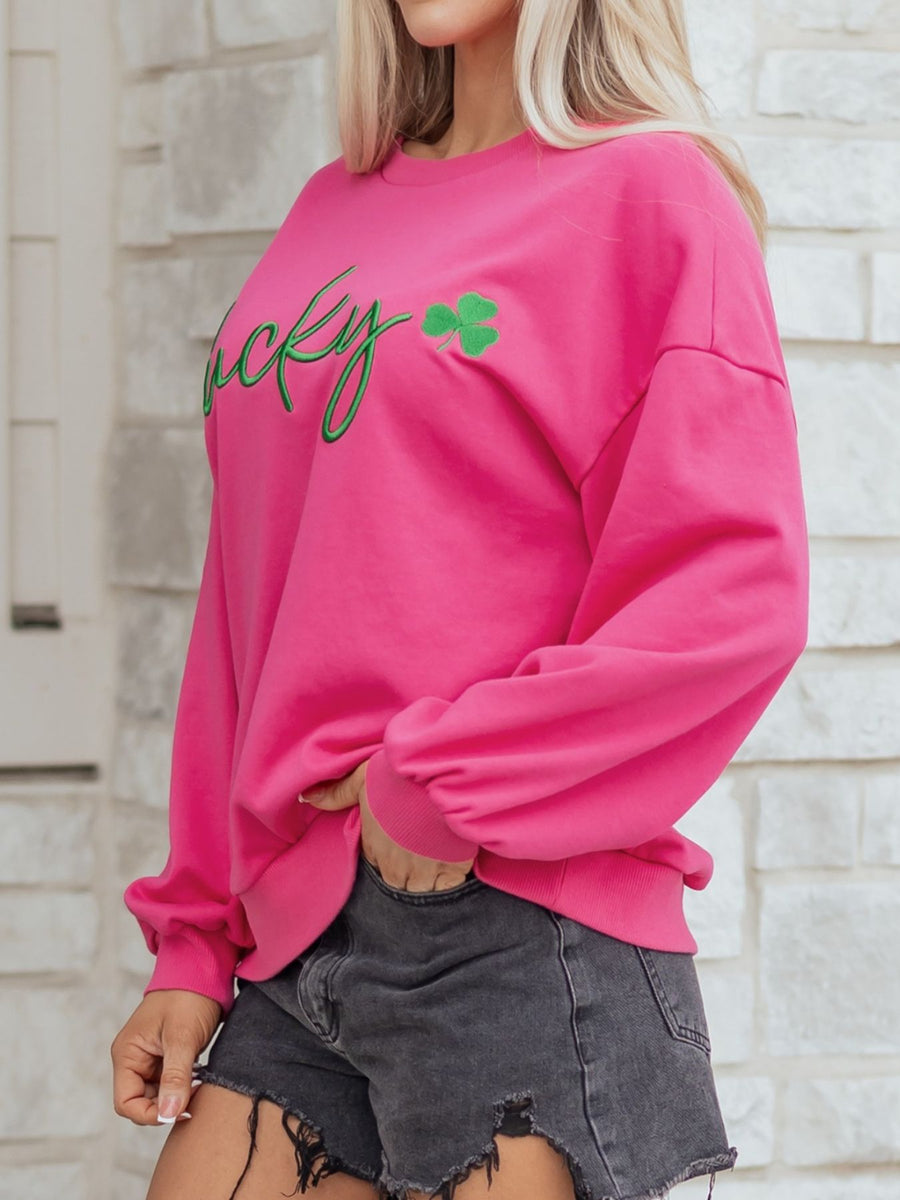Pink crew neck cotton sweatshirt with green embroidered lucky clover detail