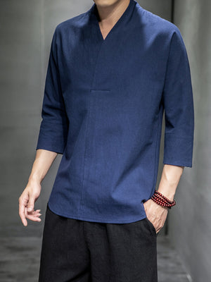 Men's blue relaxed fit V-neck 3/4 sleeve shirt with a cotton blend fabric.