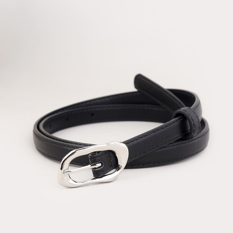Black leather belt with irregular silver buckle and loop detail.