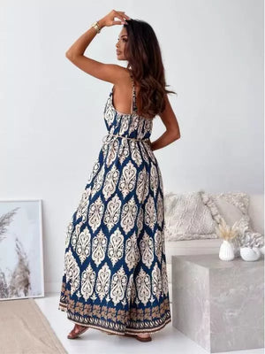 Peacock blue paisley maxi romper with tie belt and spaghetti straps.