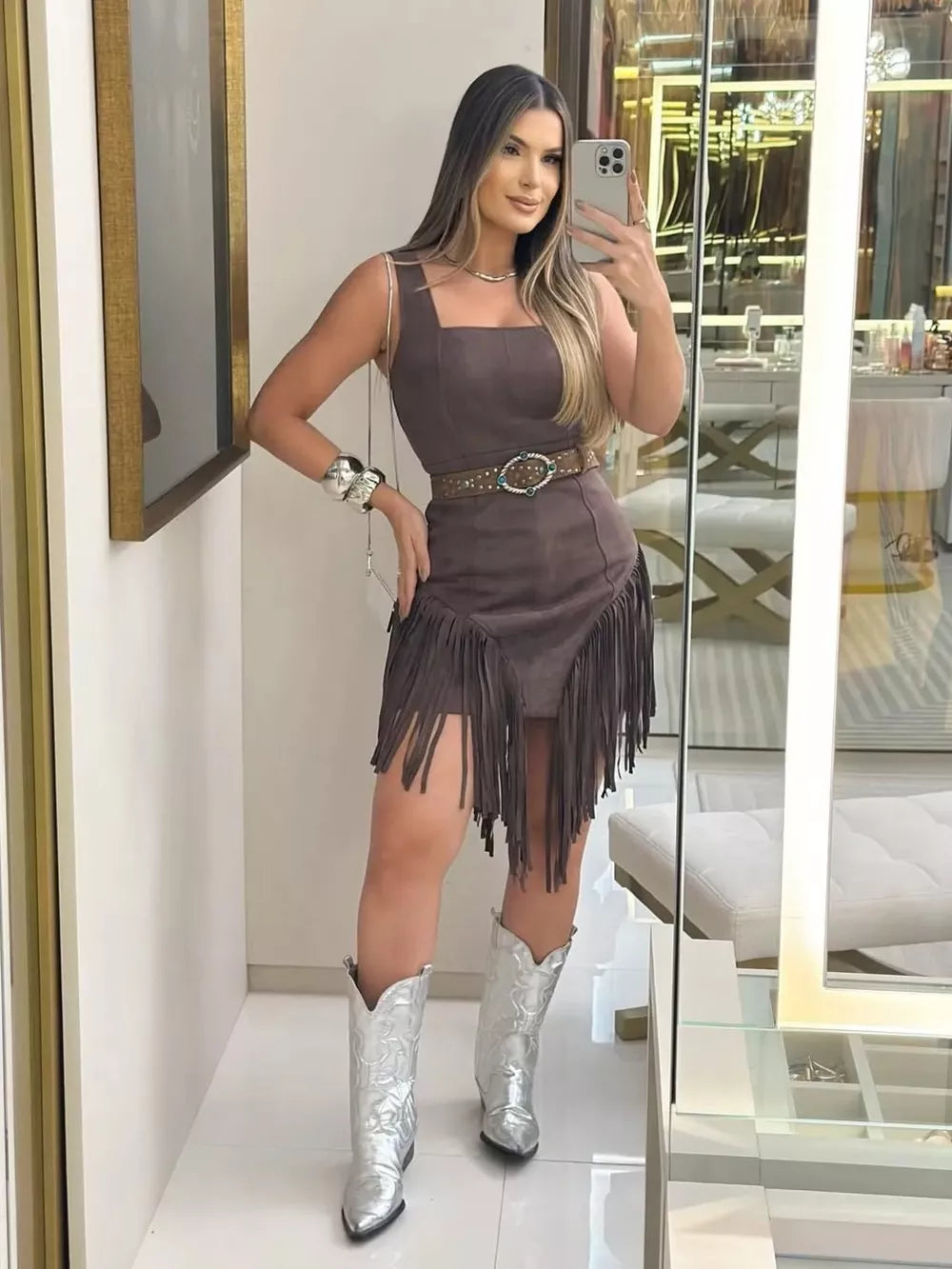 Brown cotton blend asymmetrical mini dress with fringe detail and square neckline.