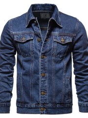 Medium wash denim trucker jacket with classic fit, button front, and chest pockets.