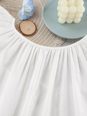 White relaxed mini dress with tie neck