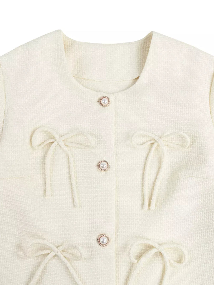 Cream tweed jacket with pearl buttons and tie bows