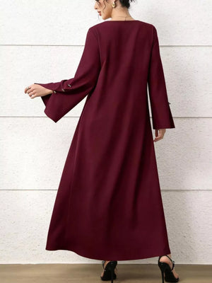 Maxi dress in burgundy with square neck, flare sleeves, and button detail.