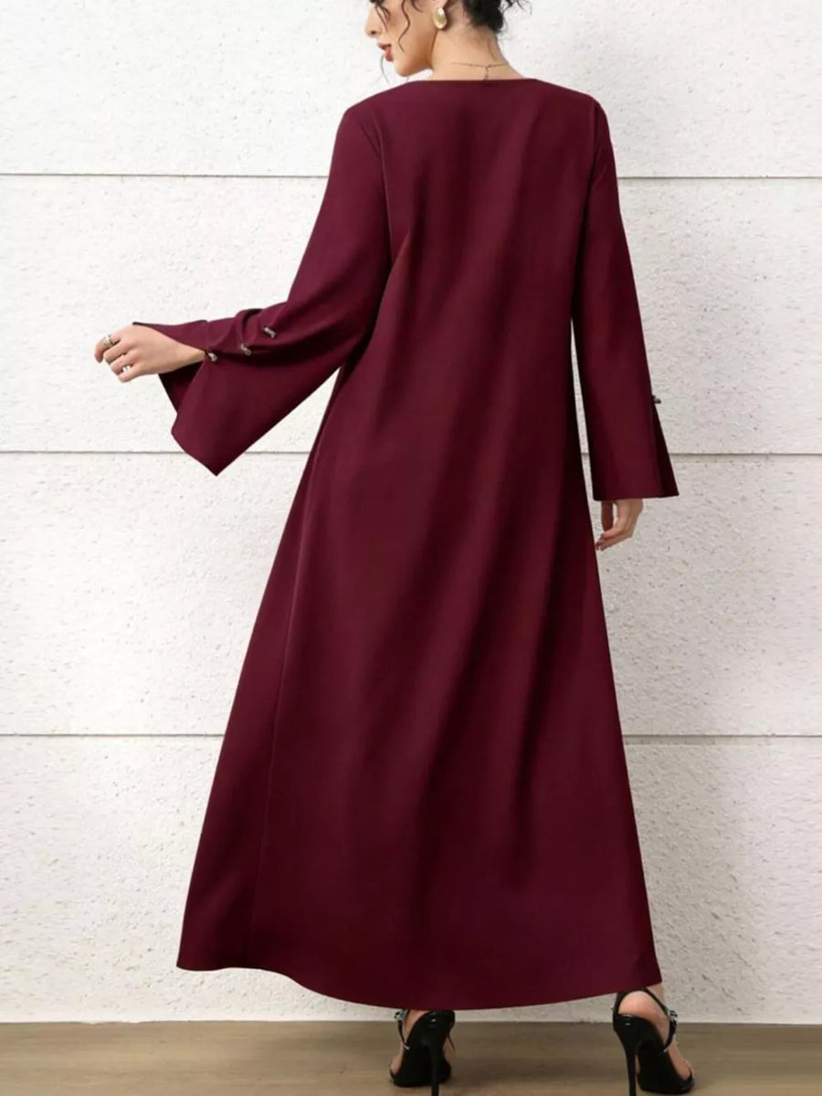 Maxi dress in burgundy with square neck, flare sleeves, and button detail.