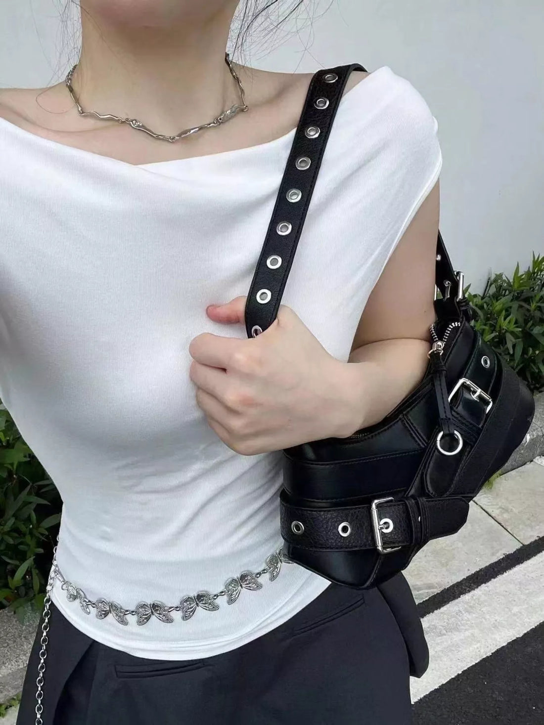 Black medium shoulder bag with buckle and grommet strap details