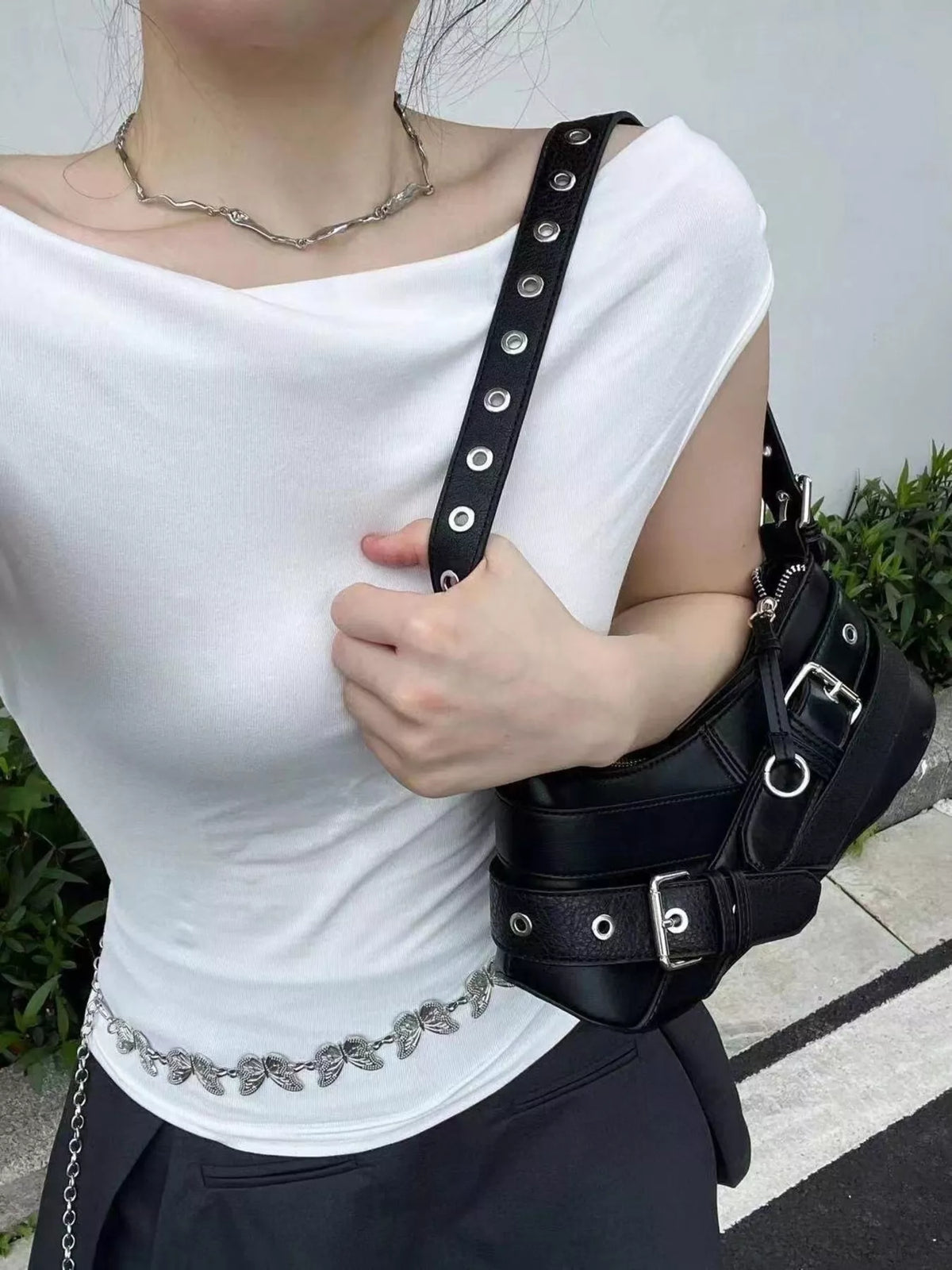 Black medium shoulder bag with buckle and grommet strap details