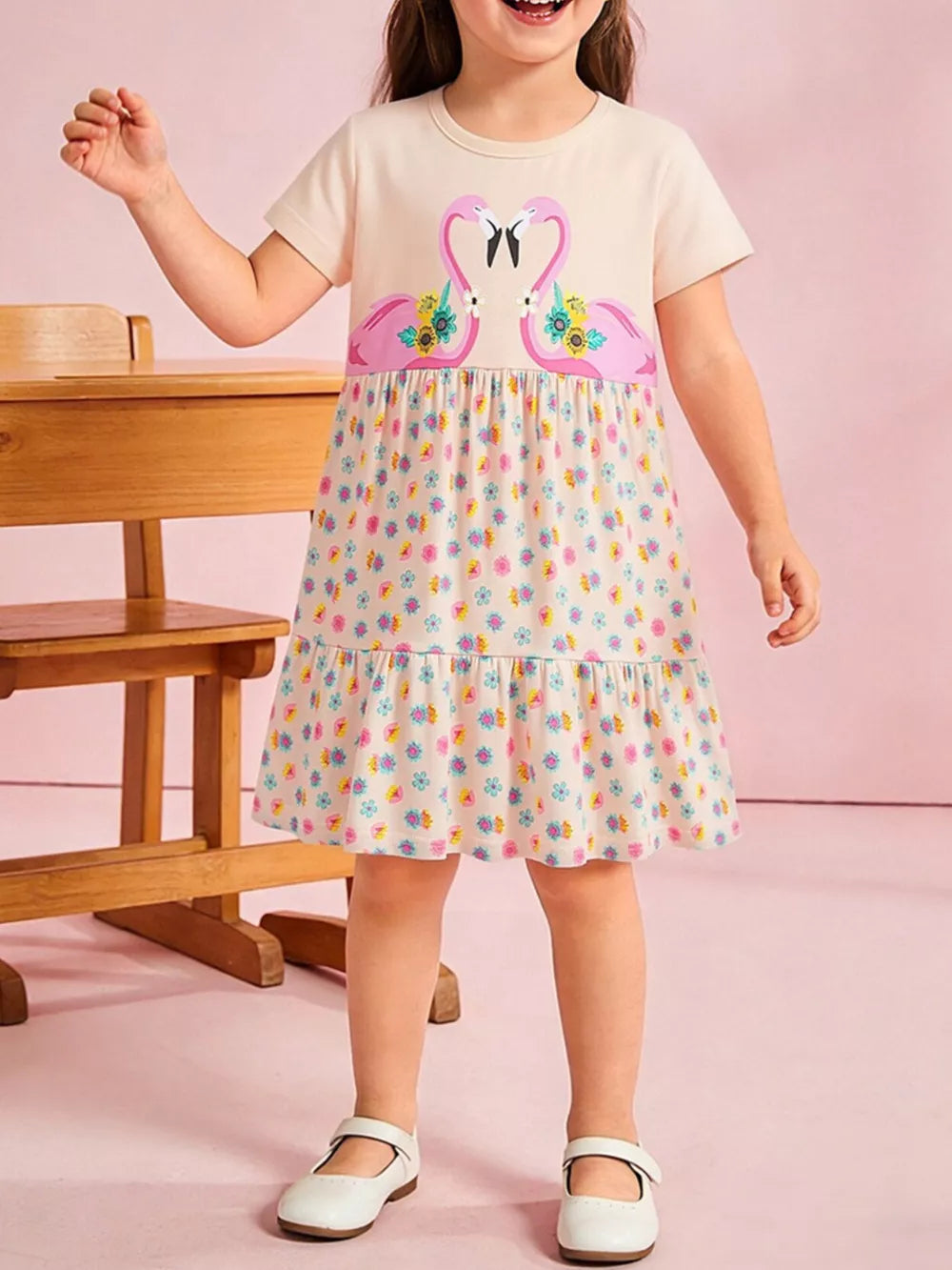 Baby dress with flamingo print on cream top and floral skirt, short sleeves, round neck, tiered hem