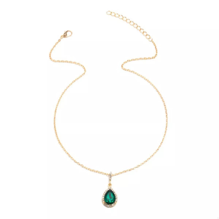 18K gold-plated necklace with dark green teardrop crystal pendant and crystal halo detail.