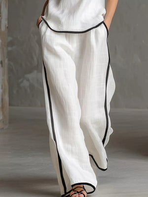 100% polyester Care instructions: Machine wash cold pajama set in black with relaxed silhouette