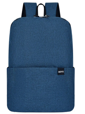 Textured Dark Blue Backpack with minimalist design and black logo tag.