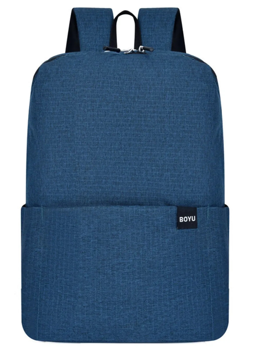 Textured Dark Blue Backpack with minimalist design and black logo tag.