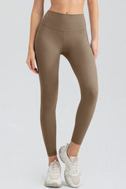 Khaki high-waist performance leggings with sculpted seams and a full-length cut.