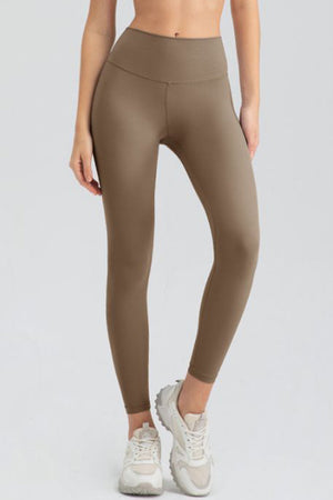 Khaki high-waist performance leggings with sculpted seams and a full-length cut.