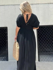 Black V-neck maxi dress with dolman sleeves and smocked waist, tied back detail