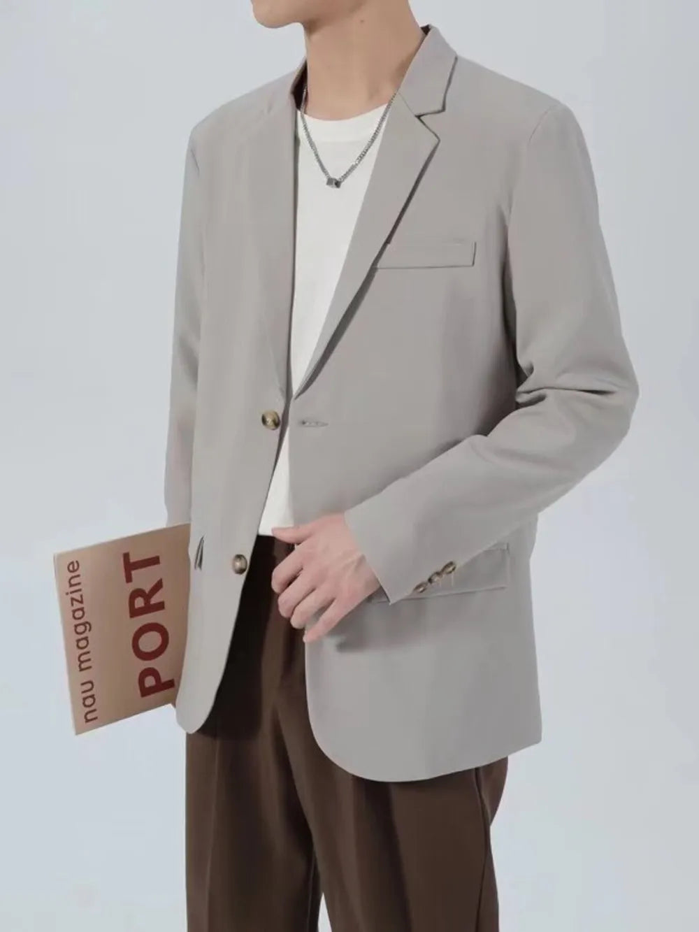 Light gray classic fit blazer with buttoned front and chest pocket.