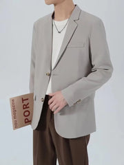 Light gray classic fit blazer with buttoned front and chest pocket.