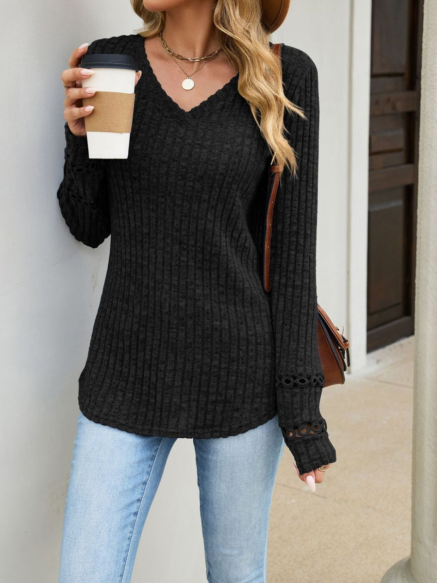 100% polyester Care instructions: Machine wash cold v-neck sweater in Black with regular silhouette