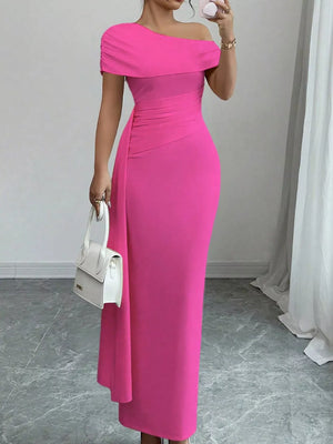 Chic asymmetrical ruched maxi dress in pink with off-the-shoulder neckline and body-hugging fit.