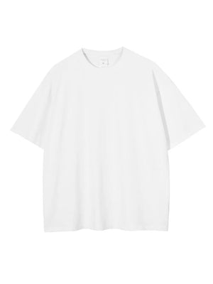White oversized washed cotton tee with relaxed fit and crew neck.