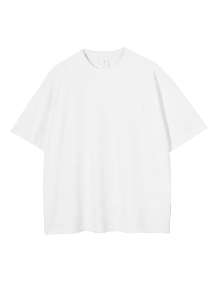 White oversized washed cotton tee with relaxed fit and crew neck.