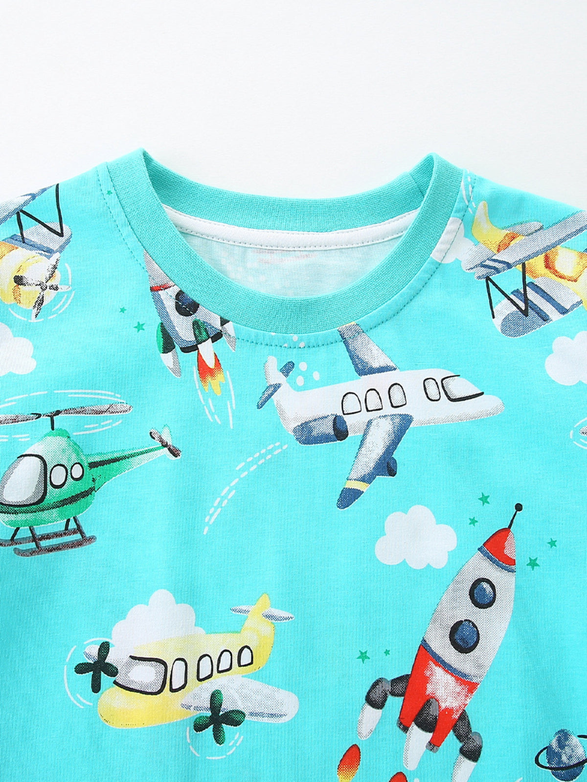Blue cotton t-shirt with playful aviation print, featuring planes, rockets, and helicopters.