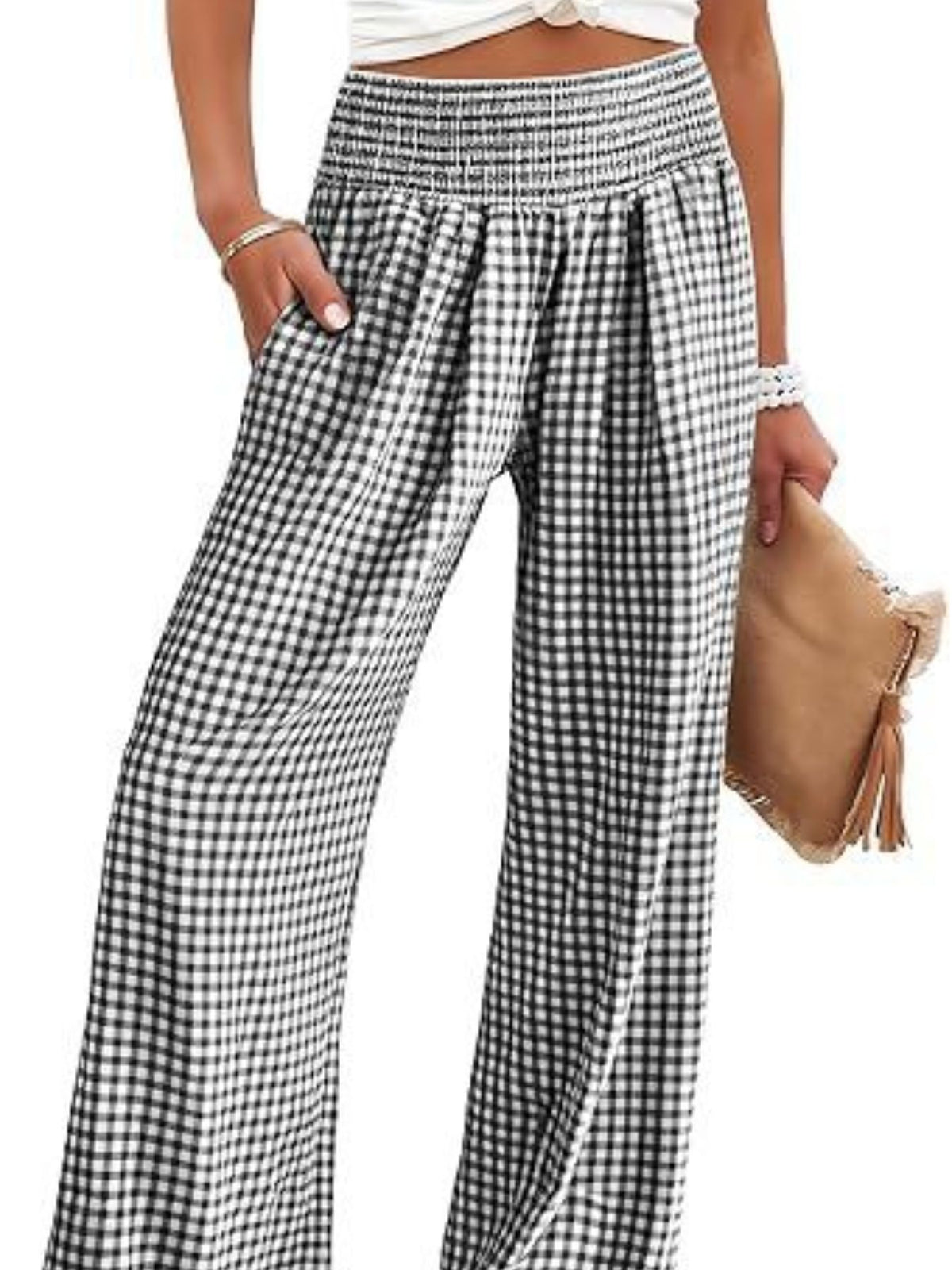 Smocked high-waist wide-leg pants in black and white gingham with pockets.