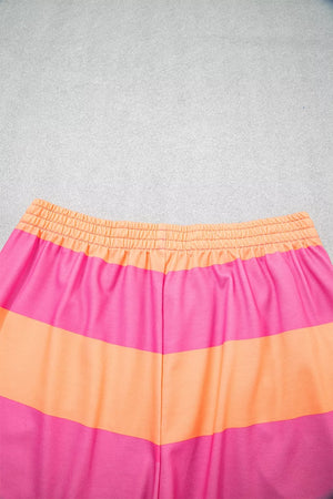Vibrant striped two-piece set with elastic waistband and drawstring detail.