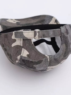 Baseball cap with grey camouflage pattern and adjustable metal buckle strap.