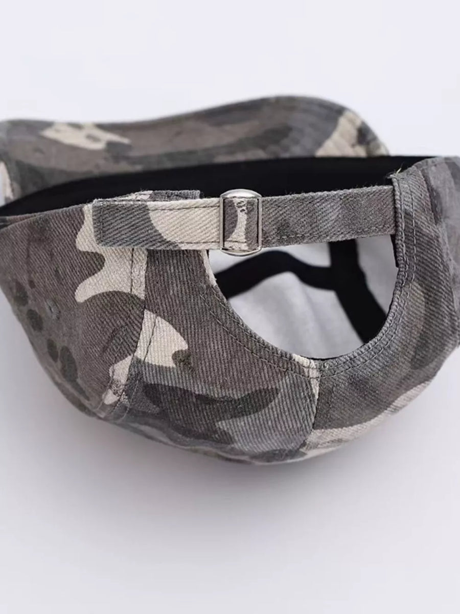 Baseball cap with grey camouflage pattern and adjustable metal buckle strap.