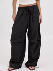 wide-leg pants in Black with drawstring waist and full-length