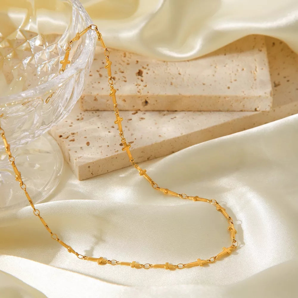 Gold necklace featuring gold-plated and geometric