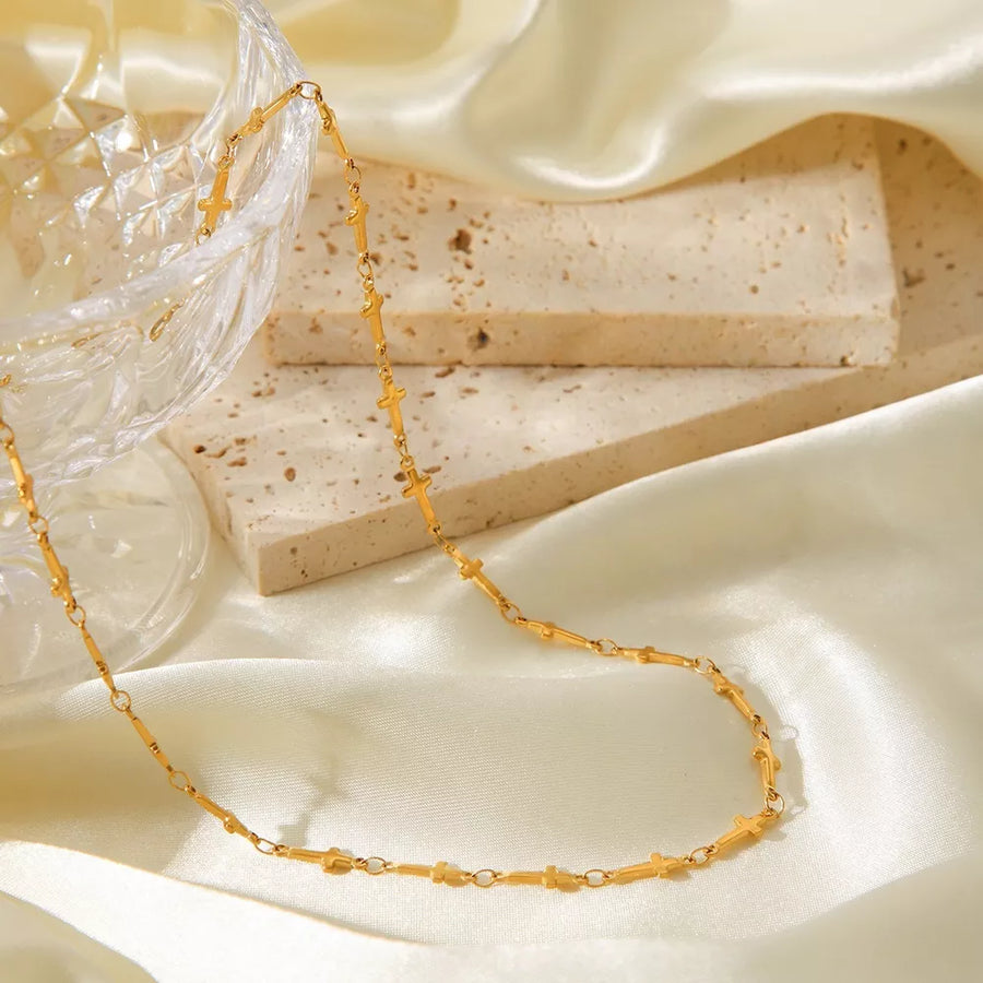 Gold necklace featuring gold-plated and geometric