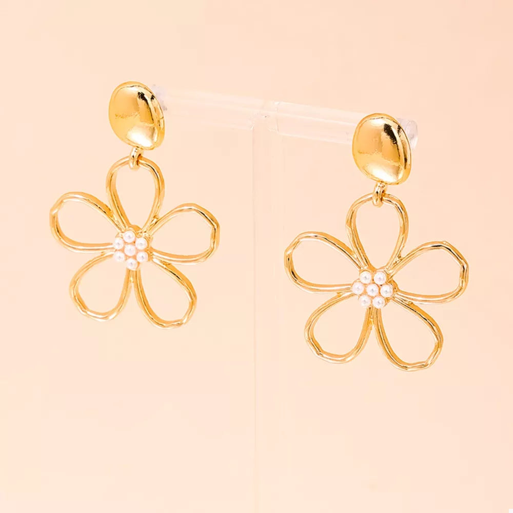 silver earrings featuring drop design and floral