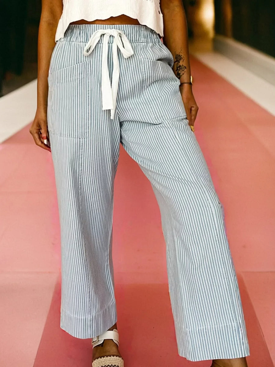 Light blue striped drawstring jeans with a mid-rise and wide leg.