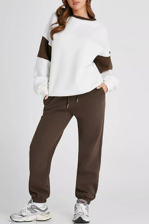 Oversized white sweatshirt with chocolate sleeves and matching chocolate sweatpants.