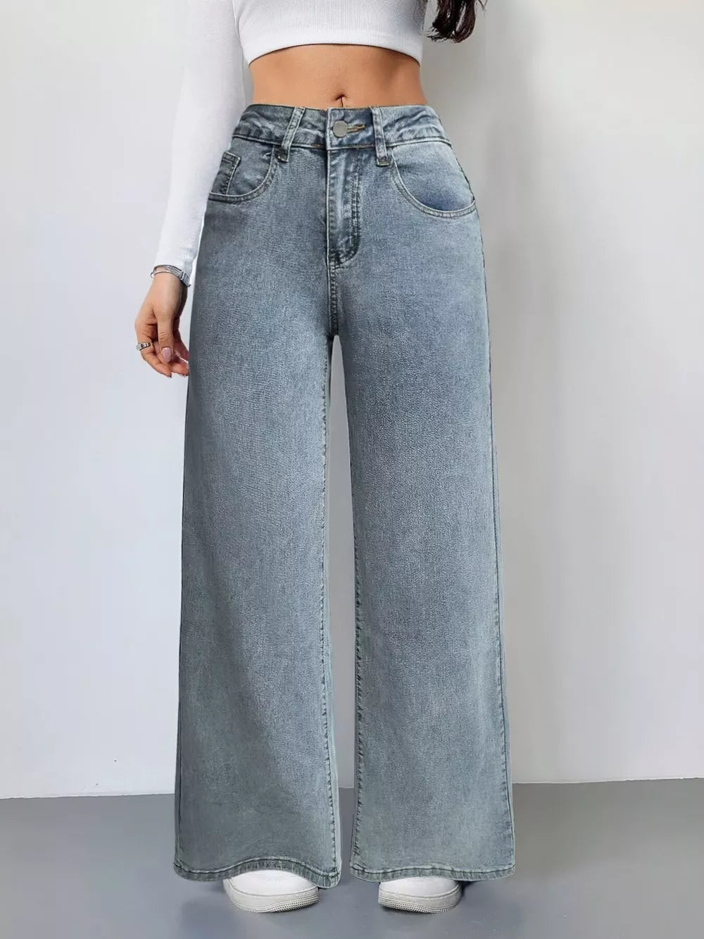 Light wash denim wide-leg high-waist jeans with a relaxed fit.