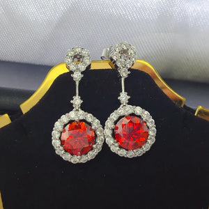 earrings in ruby red featuring drop design and drop fit