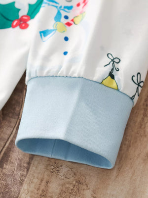 White children's pajama sleeve with snowman print and light blue cuff