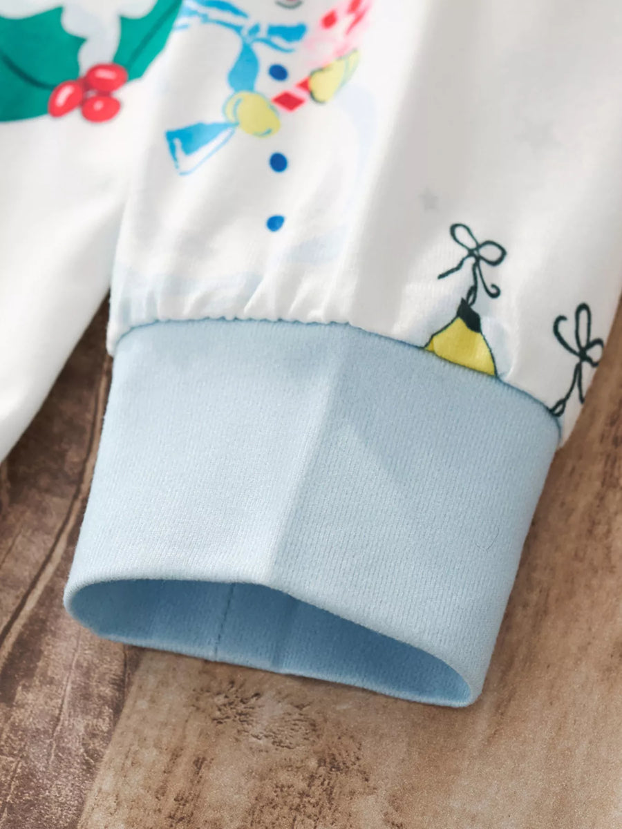 White children's pajama sleeve with snowman print and light blue cuff