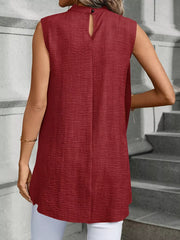 Wine red sleeveless mock neck tank top with textured fabric and back button closure.