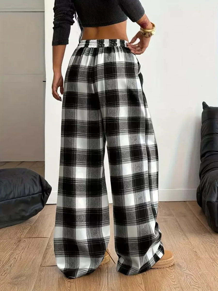100% polyester Care instructions: Machine wash cold wide-leg pants in Black And White with loose silhouette
